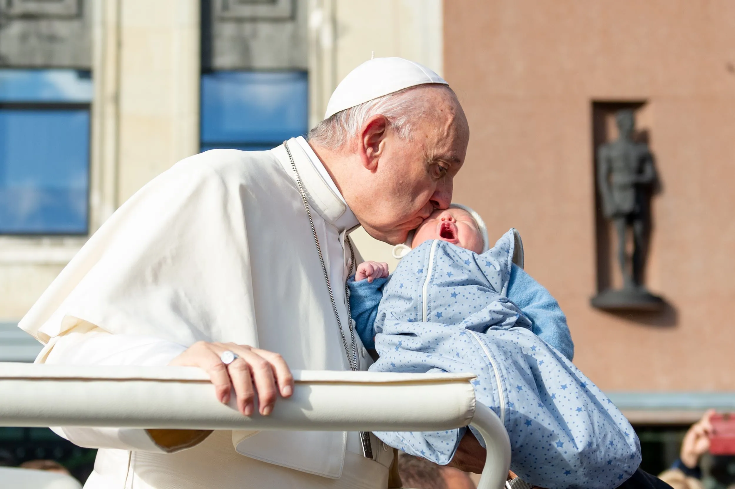 Pope Francis with a child