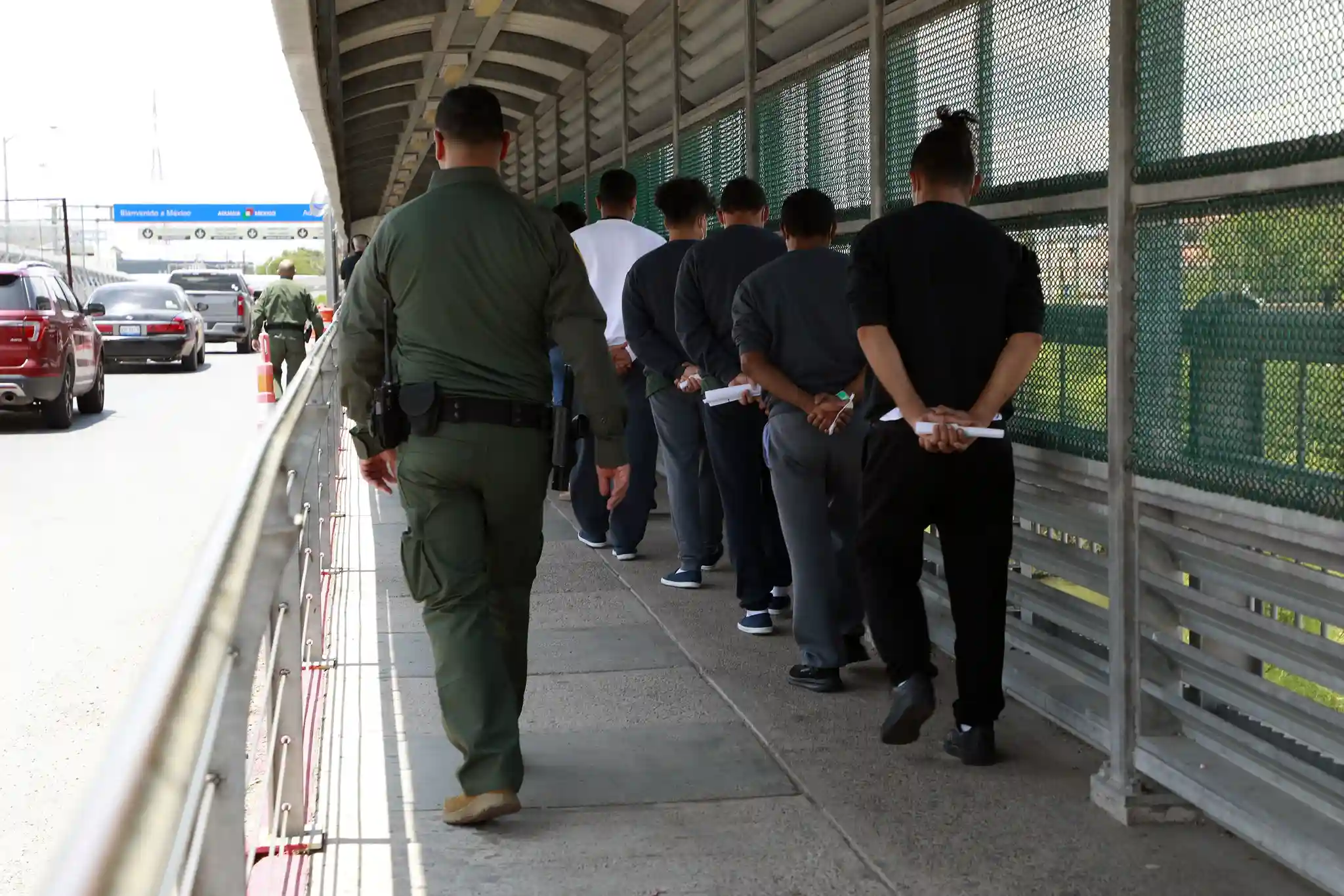 Customs and Border Protection personnel with illegal migrants in Hidalgo, Texas